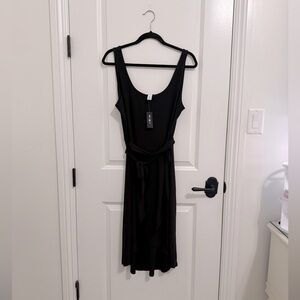 White House Black Market NWT Black faux wrap dress.